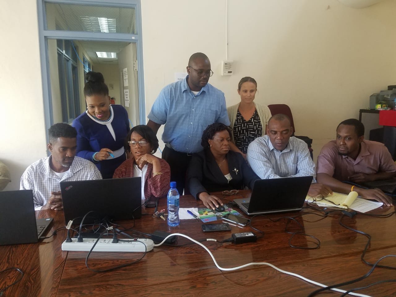 Facilitators review participants' progress during working session.