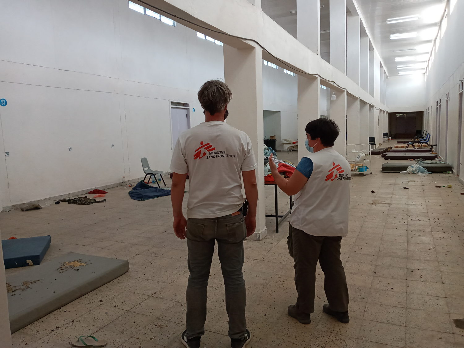Two MSF staff inspect a room that will be converted into a hospital ward in Adigrat, in Tigray, northern Ethiopia. Copyright: MSF