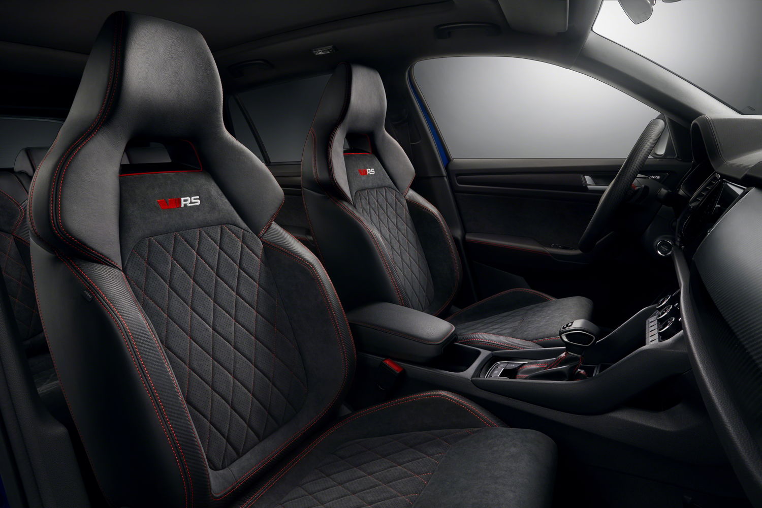 The sports seats in the new high-performance SUV feature perforated Alcantara and carbon leather with red contrast stitching.