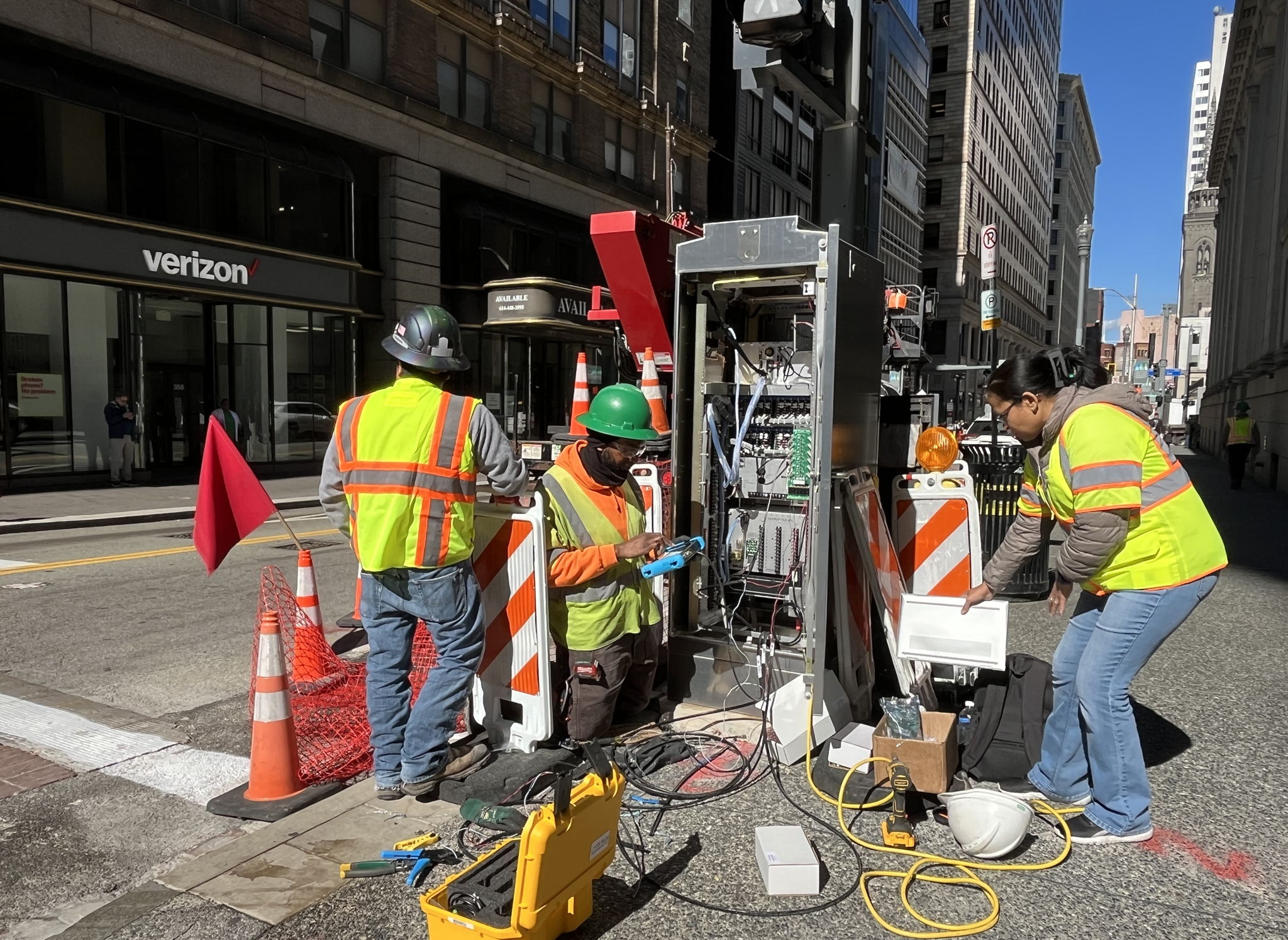 Electrical crew activating new traffic signals on Fifth Avenue at Smithfield Street
