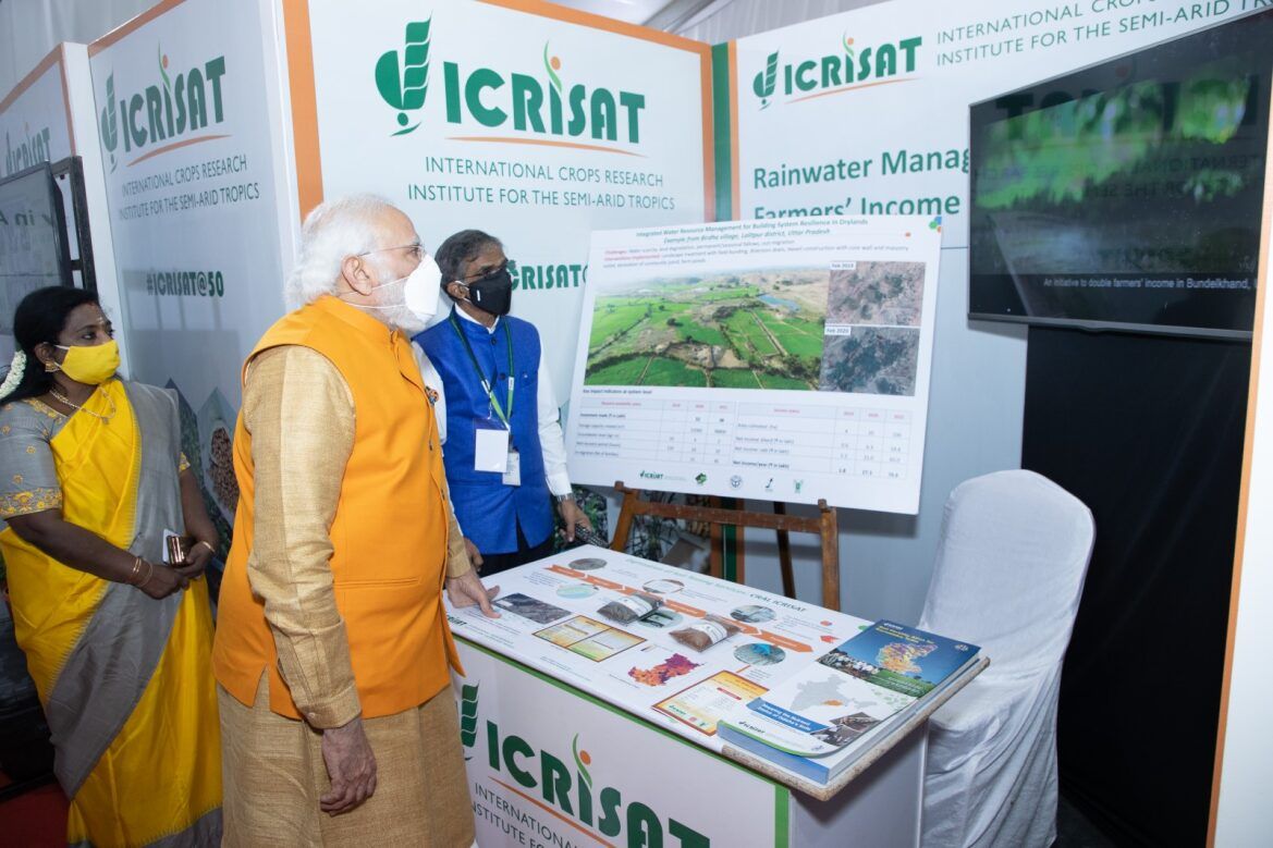 File photo of  Prime Minister of India Mr Narendra Modi, flanked by the Governor of Telangana, Dr Tamilisai Soundararajan, and Dr Sreenath Dixit, watching a presentation on ICRISAT work in Bundelkhand, India