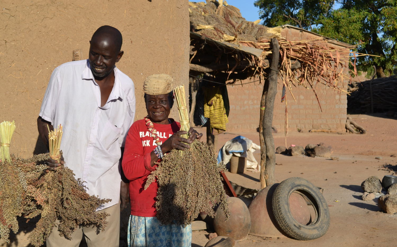 Farmer Bourama Bougodogo with his mother outside their home.