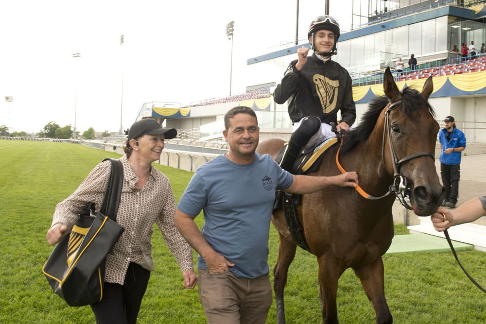 Slade Jones and his dad Juno Jones celebrate Slade's first win at Woodbine (Michael Burns Photo)