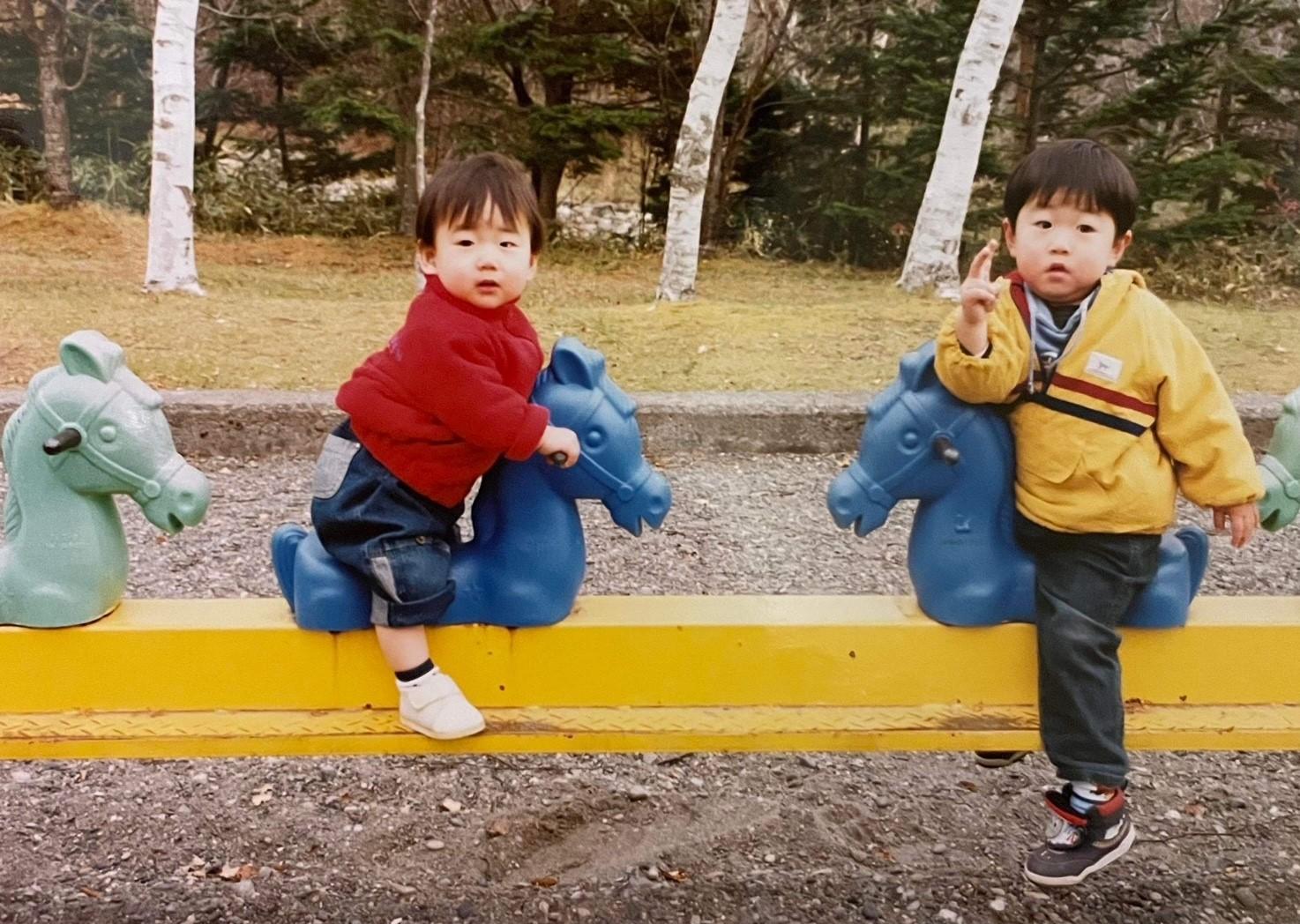 Kazushi Kimura and his brother sharing time together and their love of horses. (supplied)