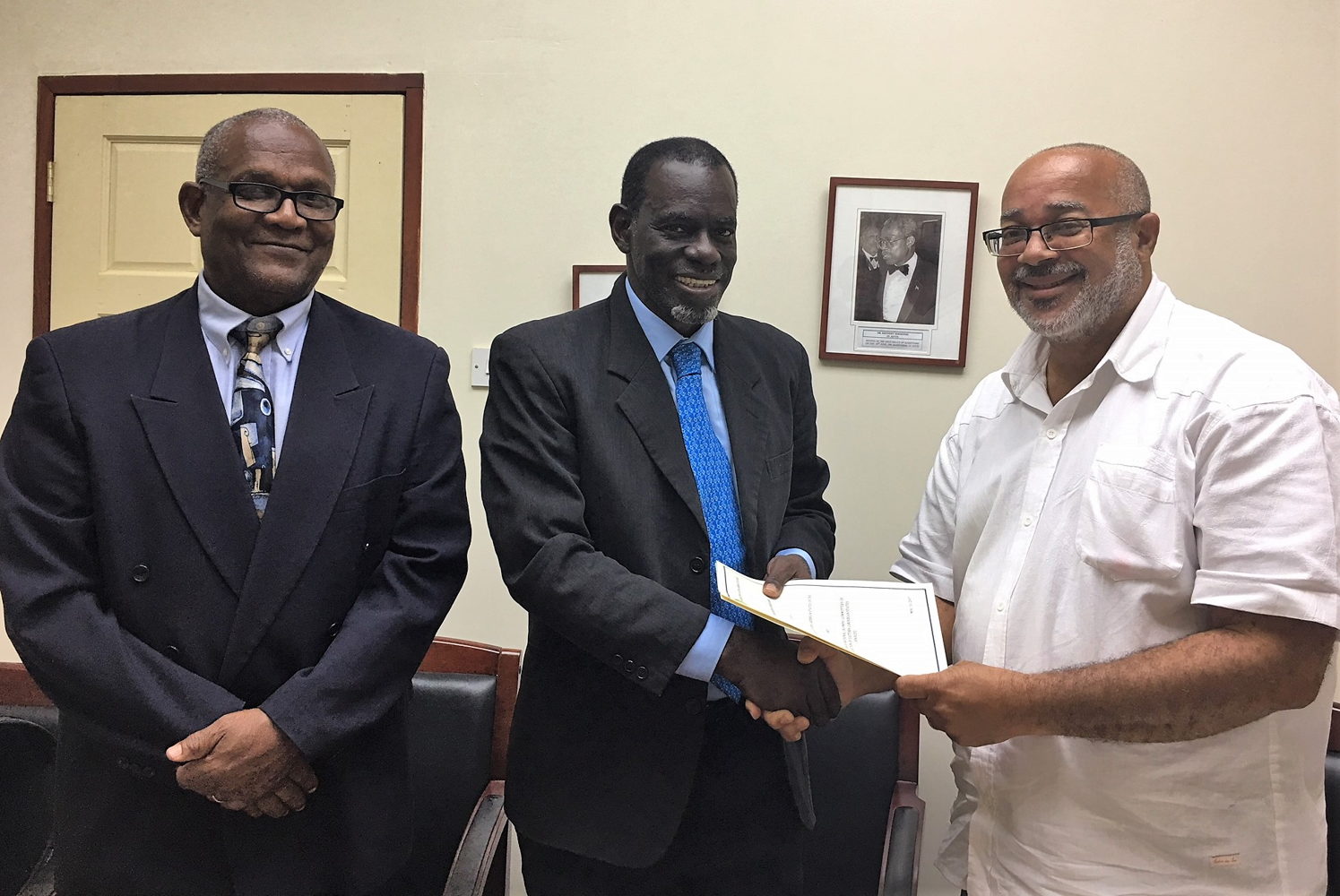 OECS Director General, Dr. Didacus Jules, and Mr. Alphonso Bridgewater, President of the ANOCES, complete MOU signing with Mr. Keith Joseph.