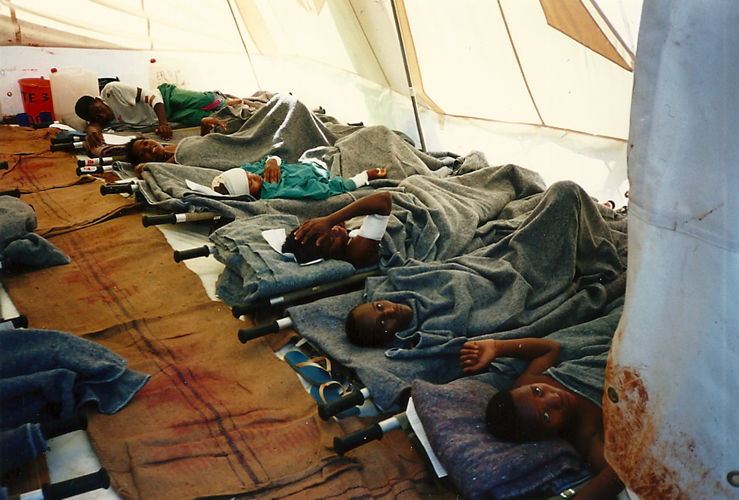Kigali, genocide Rwandan Tutsis, april 1994. On 13 April 1994, an emergency surgical mission left together with ICRC from Bujumbura in Burundi to Kigali the Rwandan capital city where a few days before had started the genocide of the Rwandan Tutsis. Within hours, an orphanage was converted into a field hospital and the first patients arrived on the very evening of the team's arrival. From 13 April 1994 until Kigali was taken by the Rwandan Patriotic Front (RPF) early July 1994, MSF teams in collaboration with the ICRC ran this hospital that over the weeks became a real refuge for the survivors of the massacres. Photographer: Xavier Lassalle