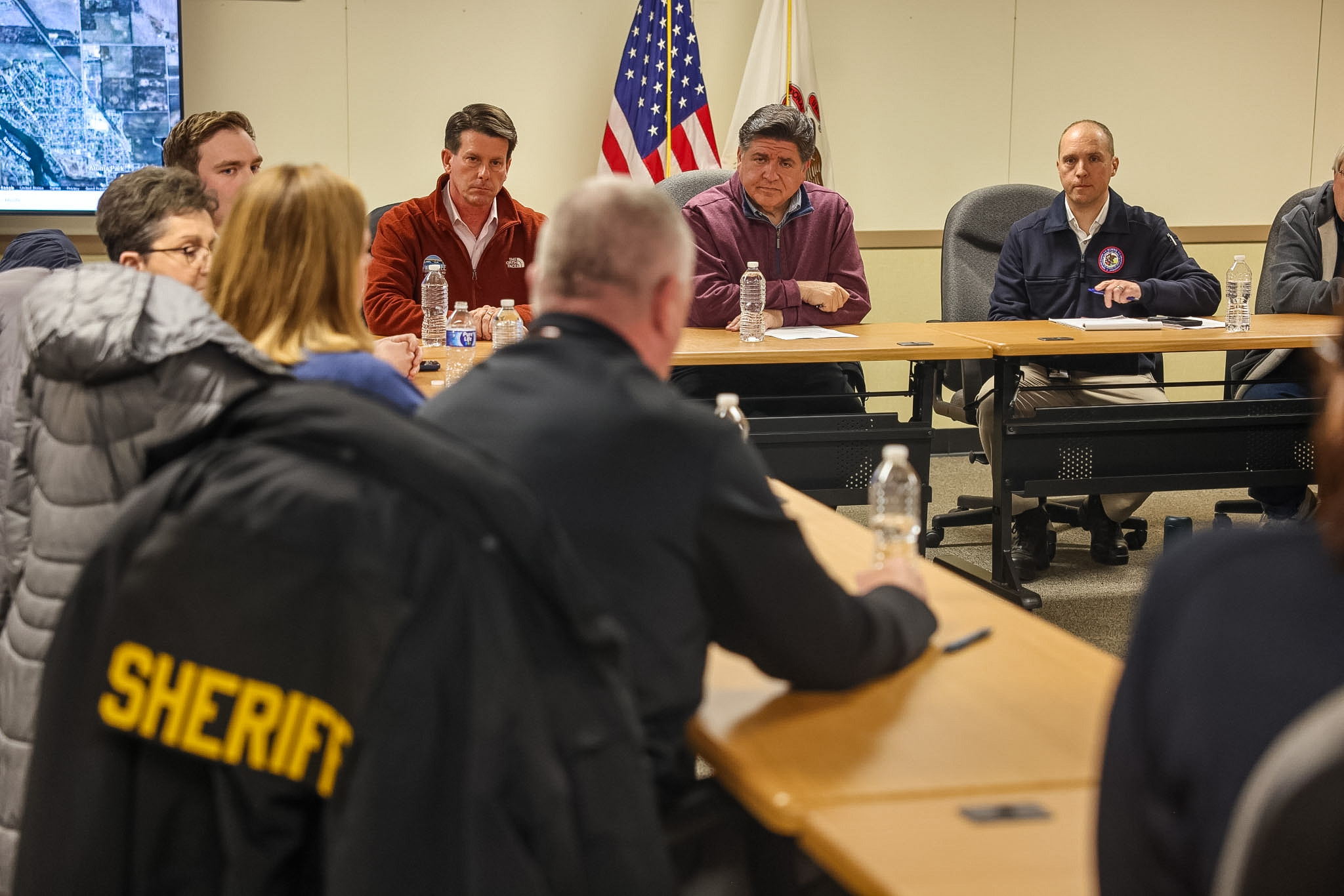 Governor Pritzker is briefed on the damages to Kankakee County by local officials, first responders, and the Illinois Emergency Management Agency, along with Mayor of Kankakee Chris Curtis (left) and Acting IEMA-OHS Director Ted Berger (right).
