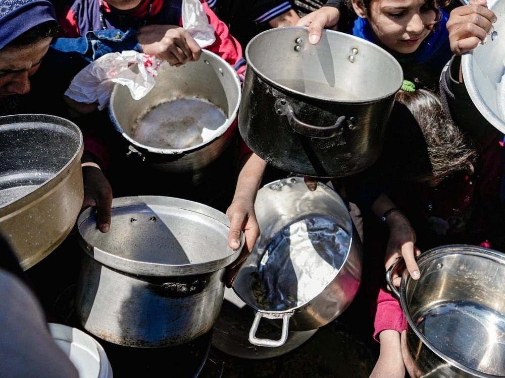 Kids holding their empty pots at a community kitchen in Northern Gaza. Photographer: Nour Alsaqqa | Location: Gaza | Date: 01/02/2025 Kids holding their empty pots at a community kitchen in Northern Gaza. Photographer: Nour Alsaqqa | Location: Gaza | Date: 01/02/2025