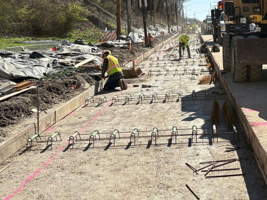 Contractors prepare Fifth Avenue between Craft Avenue and Kirkpatrick Street for paving