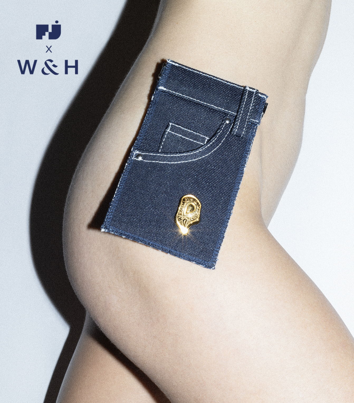 About THE JEANS POUCH ​
A reimagined denim pouch with a three pocket design and white stitching. Made from 100% Japanese denim and fitted with a top clasp closure. Logo printed on the back.