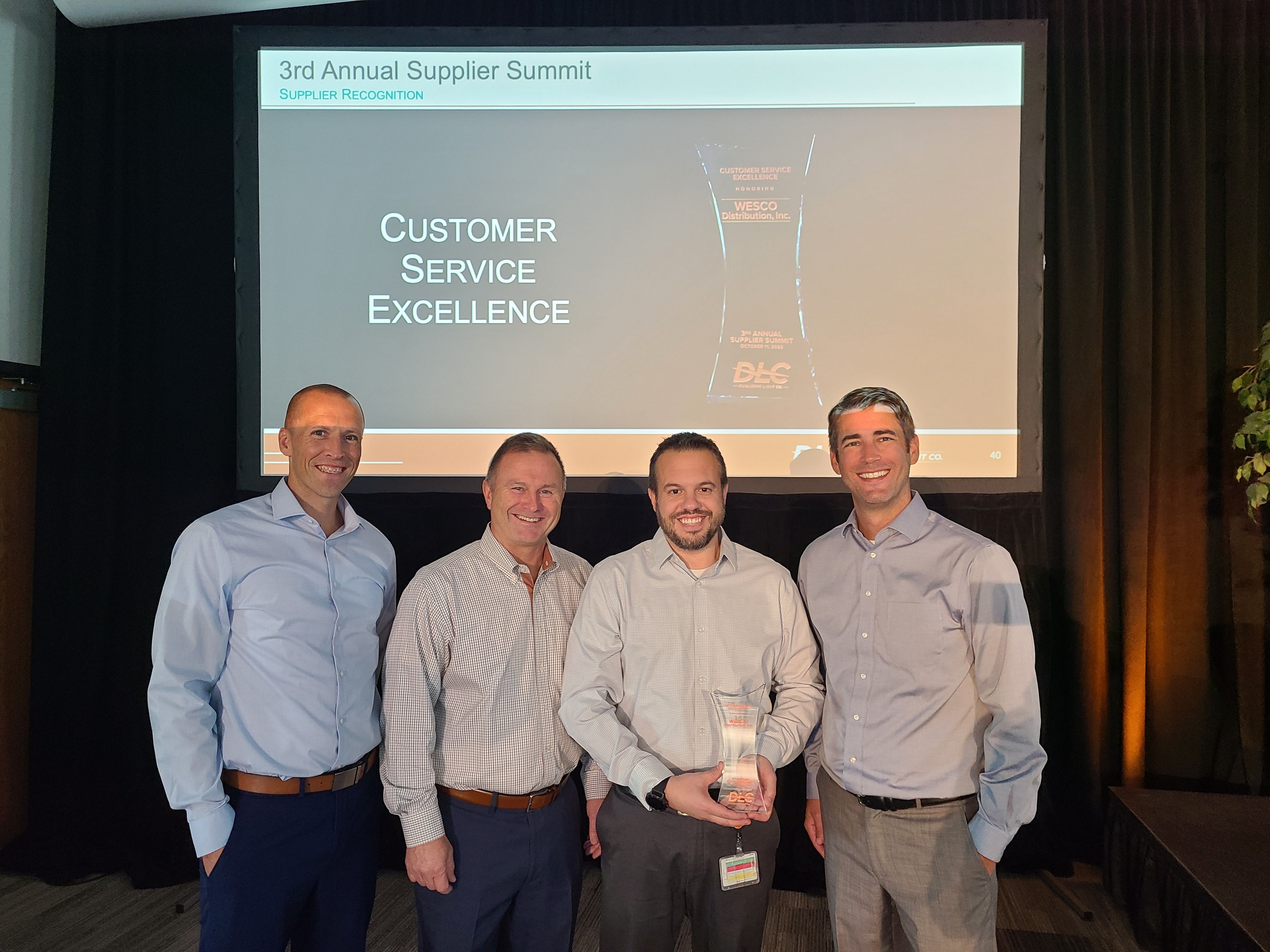 DLC Procurement Manager Brad Hiltz (L) pictured with representatives from Wesco International, which won the award for Customer Service Excellence.