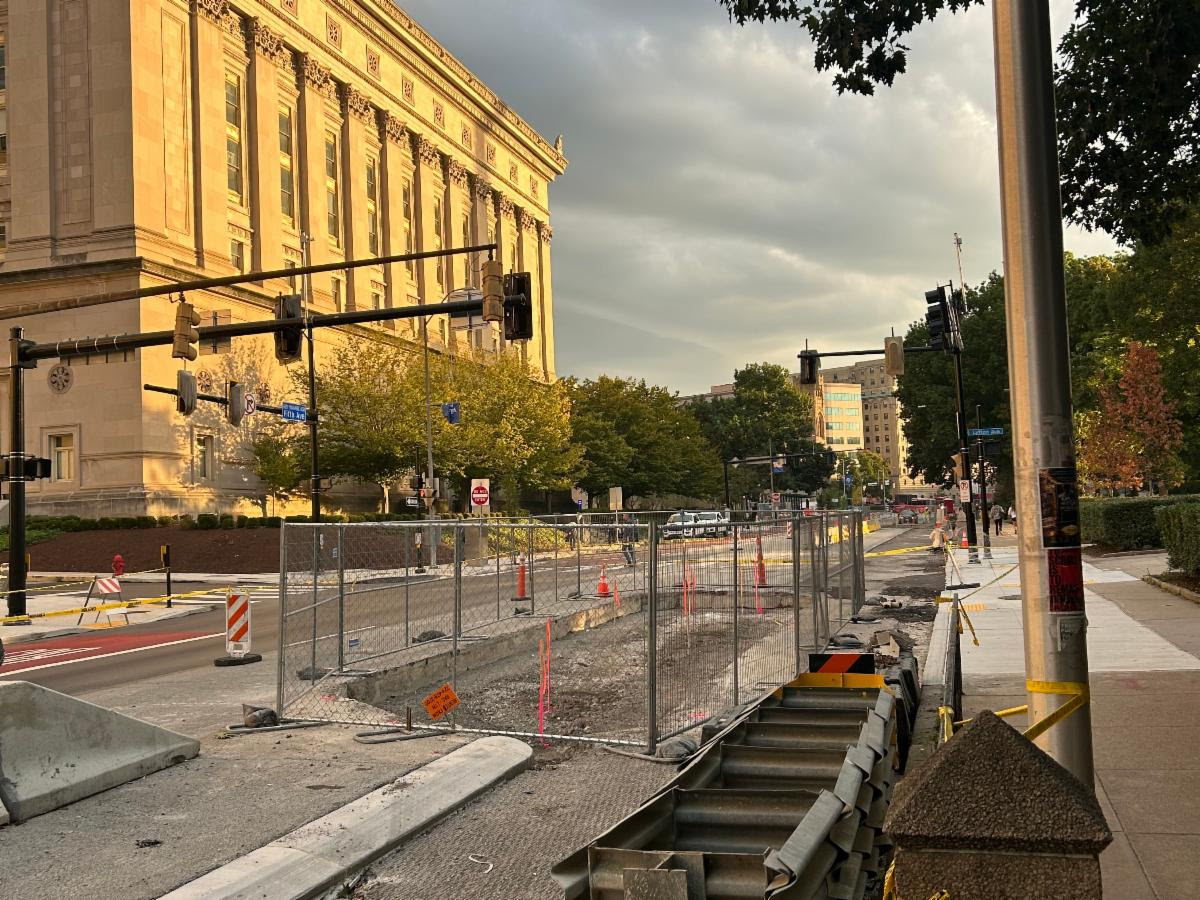 Construction site behind fencing of future traffic island along Fifth Avenue across from Lytton Avenue