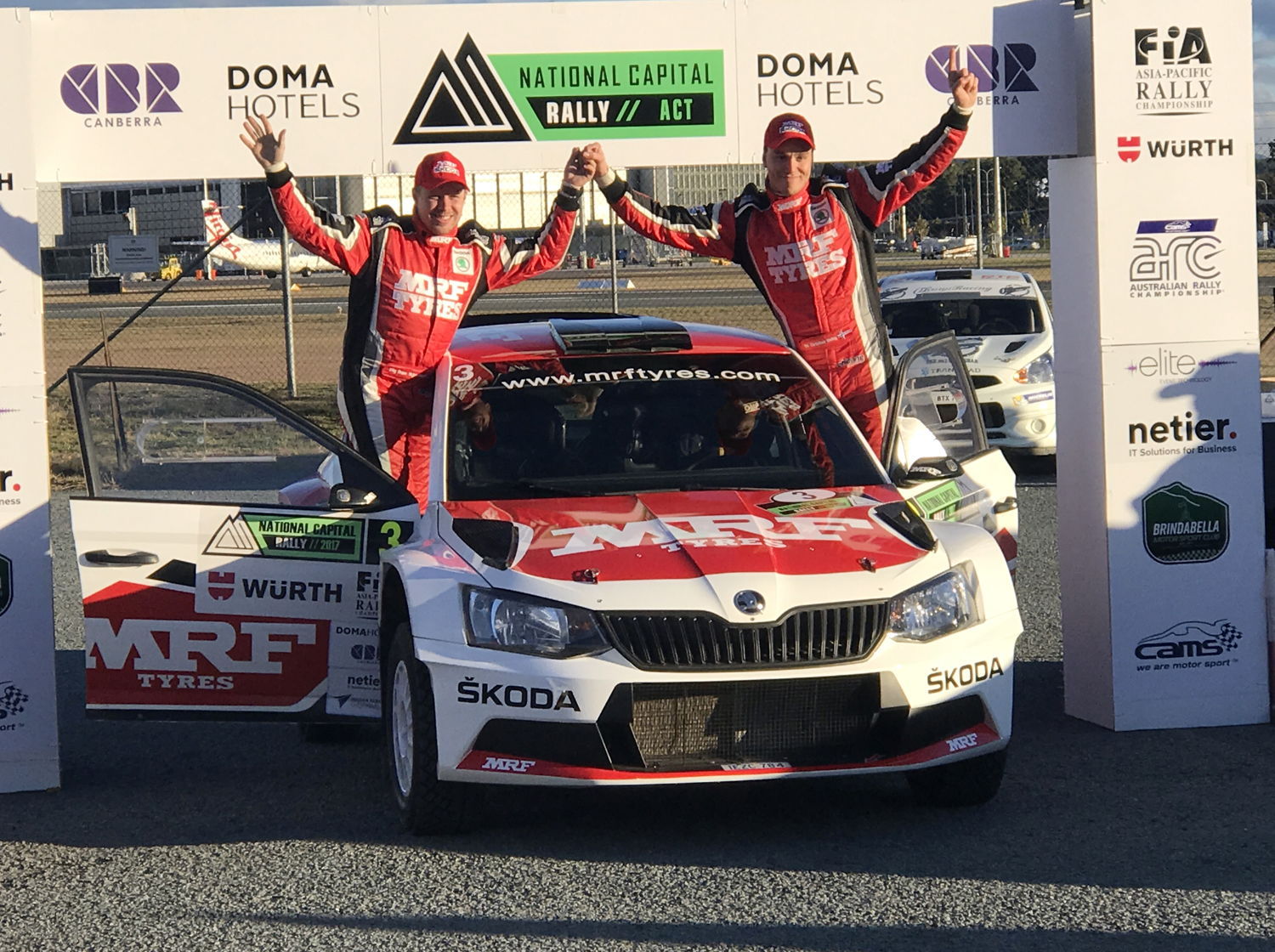 Ole Christian Veiby (right) and co-driver Stig Rune Skjaermoen celebrating their victory with their MRF ŠKODA FABIA R5