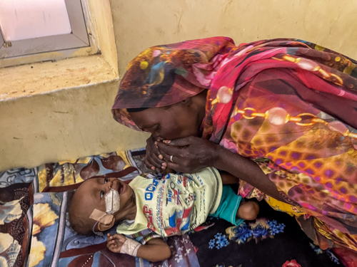 A mother cares for her child in the inpatient therapeutic feeding centre at Al Buluk hospital, supported by MSF in Omdurman, Khartoum state. 09 March, 2025. Copyright: MSF