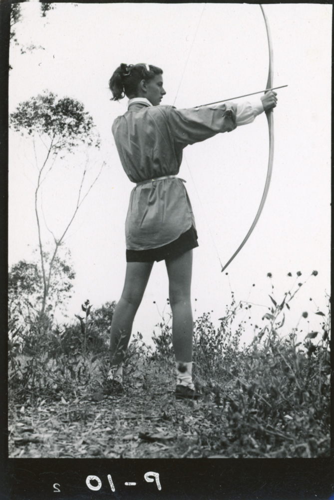 Lucia Eames practicing archery in the meadow of the Eames House site, early 1940s. Photo by Charles Eames. ©2010 Eames Office, LLC