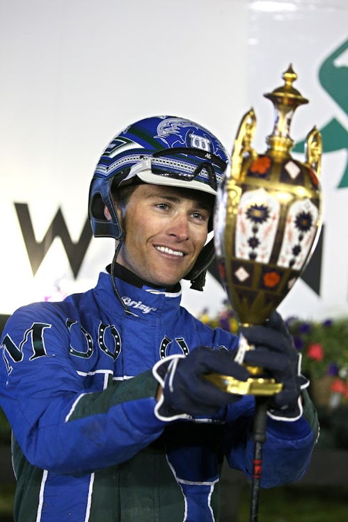 Todd McCarthy hoists the North America Cup trophy. (New Image Media)