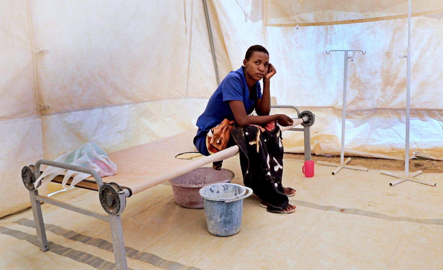 Atlas Murima (25) from Mashonaland West province in the north of Zimbabwe receives treatment for cholera at the Glenview Cholera Treatment Centre set up by MSF in collaboration with the City of Harare health department in Glenview, Harare. Atlas had travelled to Glenview to visit her sister at the time of the outbreak. Photographer: Marion Mossing