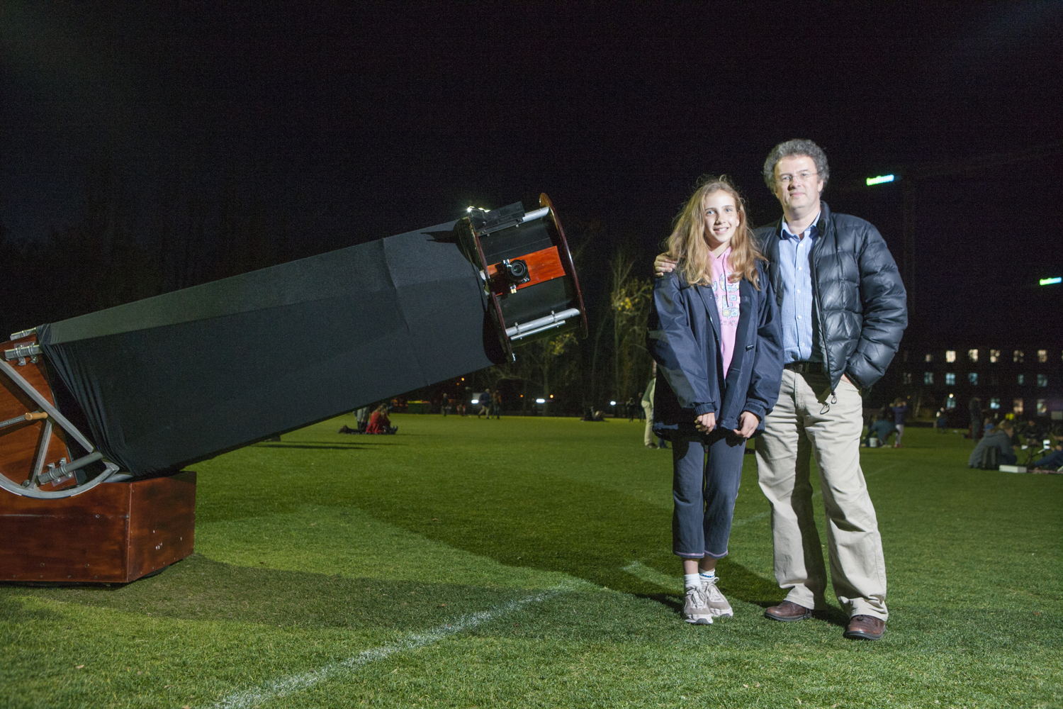 Anthony and Holly showing off their hugely impressive homemade telescope. Image: Lannon Harley, ANU
