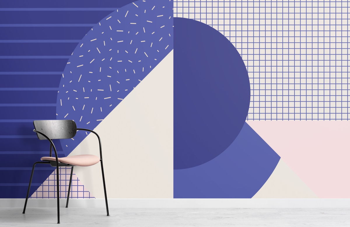 'Memphis Blues' wallpaper by Hovia reflects Very Peri in its colour palette. The mural is inspired by the digital, bold, and transitional potential of colours, like Very Peri.