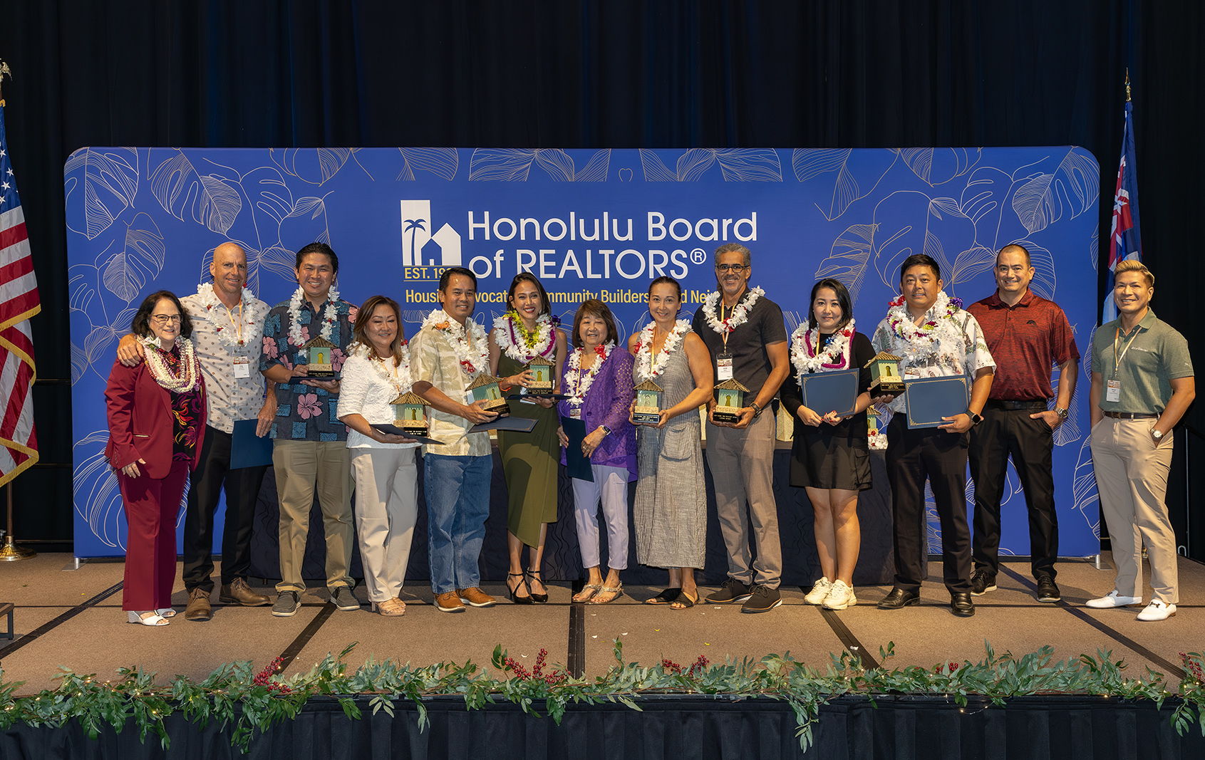 2024 Aloha ‘Āina REALTOR® Award Winners (from left to right): Greg Andrasick, Ryan S. Oda, Jamie M. Apuna, Derek C. Lau, Dollcy D. Gebauer, Yumi Laney and Christina Laney Mitre, Lonnie Bonds, Cannie Chum and Cory G. Tsuda with Award Program sponsors Suzanne Young (Honolulu Board of REALTORS®), Daniel Costigan (First Hawaiian Bank) and Michael Relayo (Honolulu Star-Advertiser). Winners not pictured: Melissa J. Filek, Melanie Long and Suzanne D. Smith. (Photo Courtesy: Honolulu Board of REALTORS®)