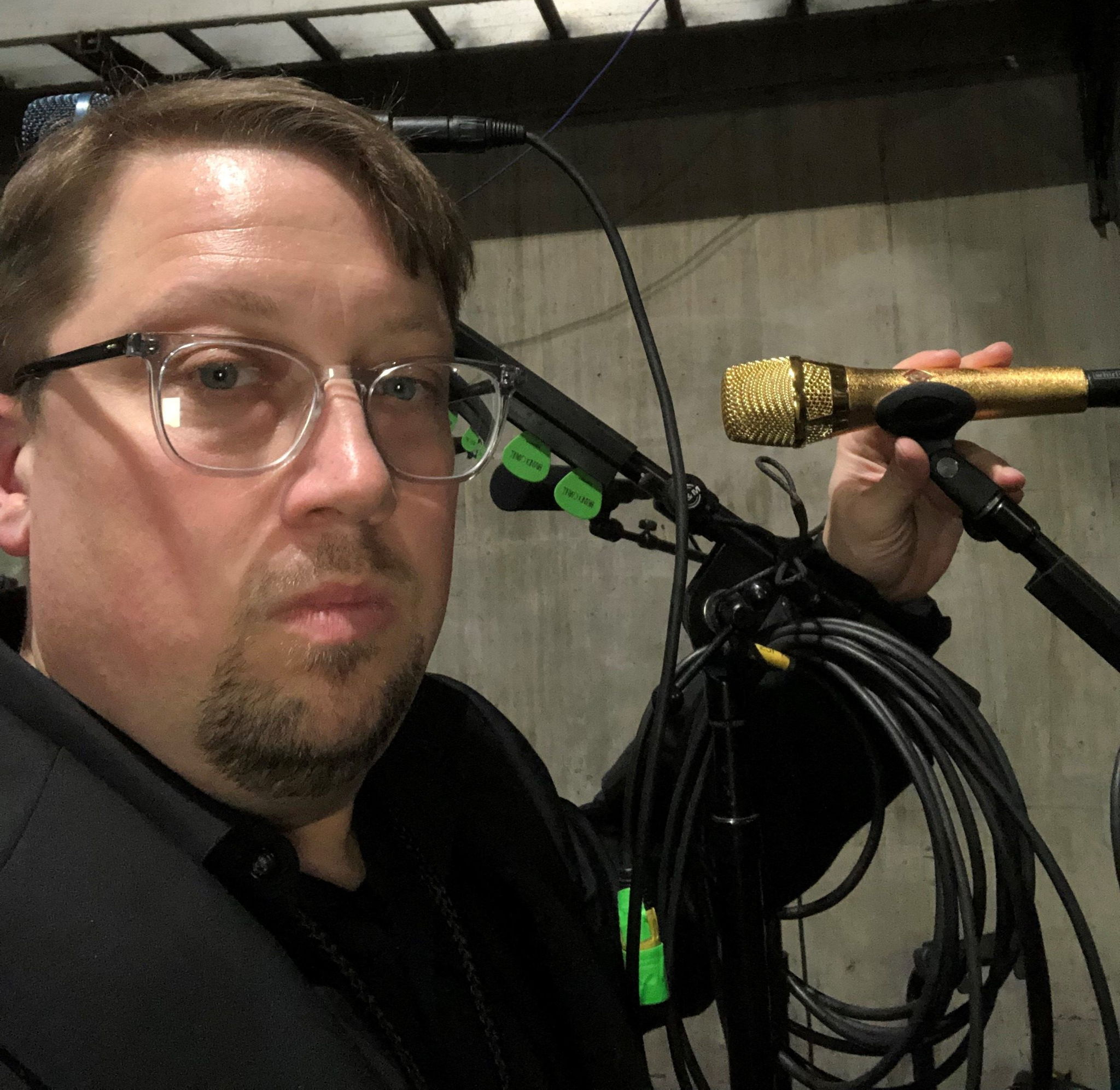 Sean Quackenbush, Front of House engineer for Brandi Carlile, pictured backstage at the 61st Annual Grammy Awards with the custom gold-colored Neumann KMS 105