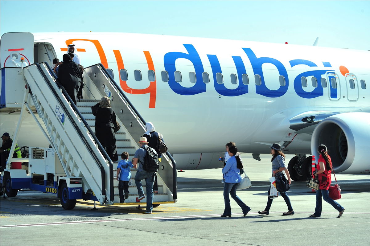 Passengers boarding a flydubai aircraft