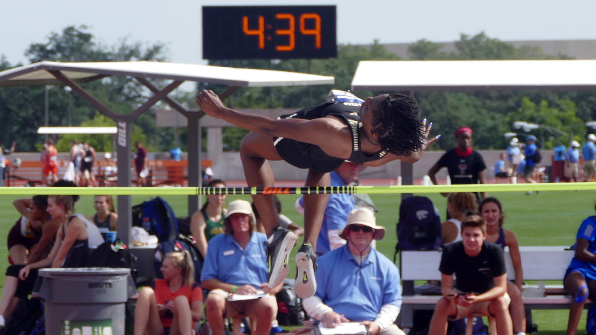 Rechelle competes in a high jump event.