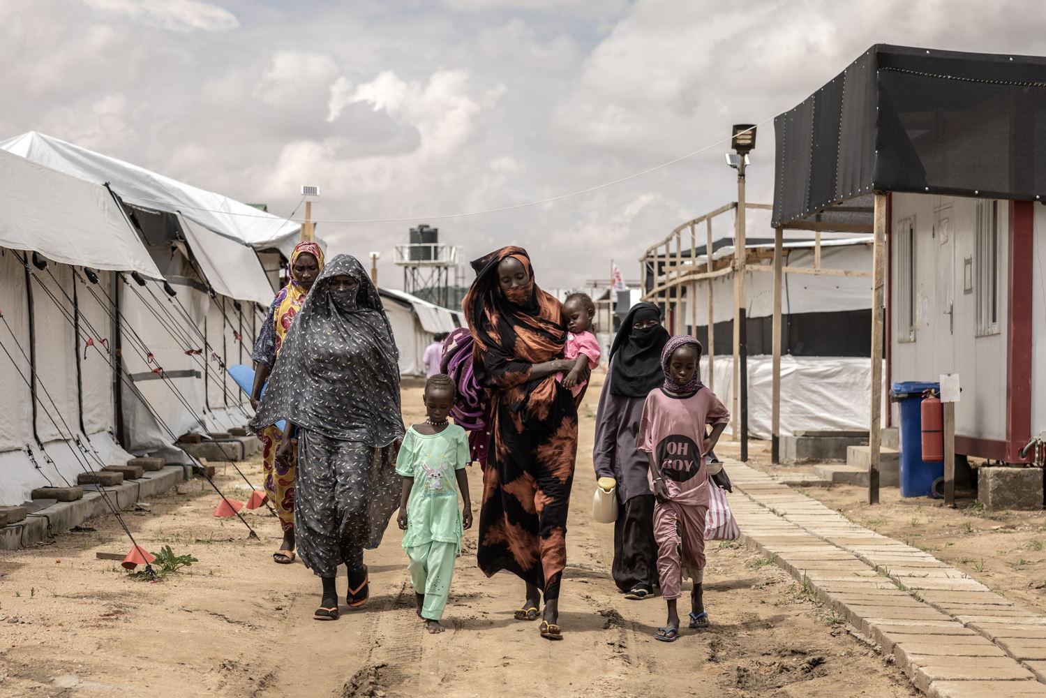 Date taken / Date Recorded: 07 August, 2024 Caption / Description: Women and children at the MSF Hospital in Metche, in eastern Chad, August 7, 2024. Metche camp hosts about 40,000 Sudanese refugees who have fled violence in Darfur. Finbarr O’Reilly/VII Photo. Page