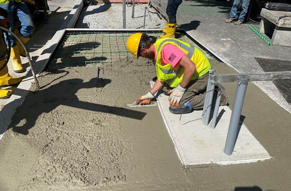 Installation of a concrete slab that will support the new bus shelter