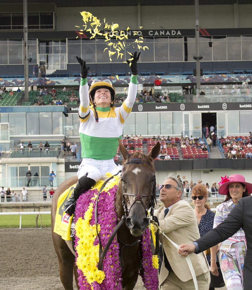 Kin's Concerto and Sofia Vives in the winner's circle for the 2024 Woodbine Oaks presented by Stella Artois (Michael Burns Photo)