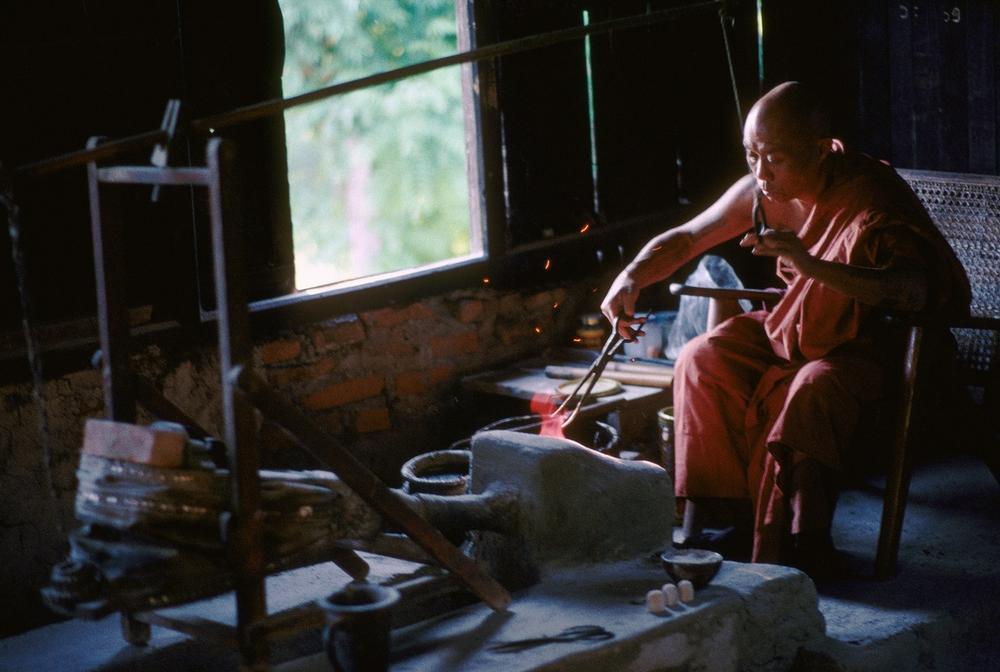 Buddhist monk melting metal, Myanmar, undated. AKG1063333