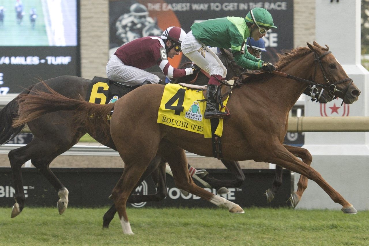 Rougir and jockey Kazushi Kimura winning the 2022 E.P. Taylor Stakes on Saturday at Woodbine (Michael Burns Photo)