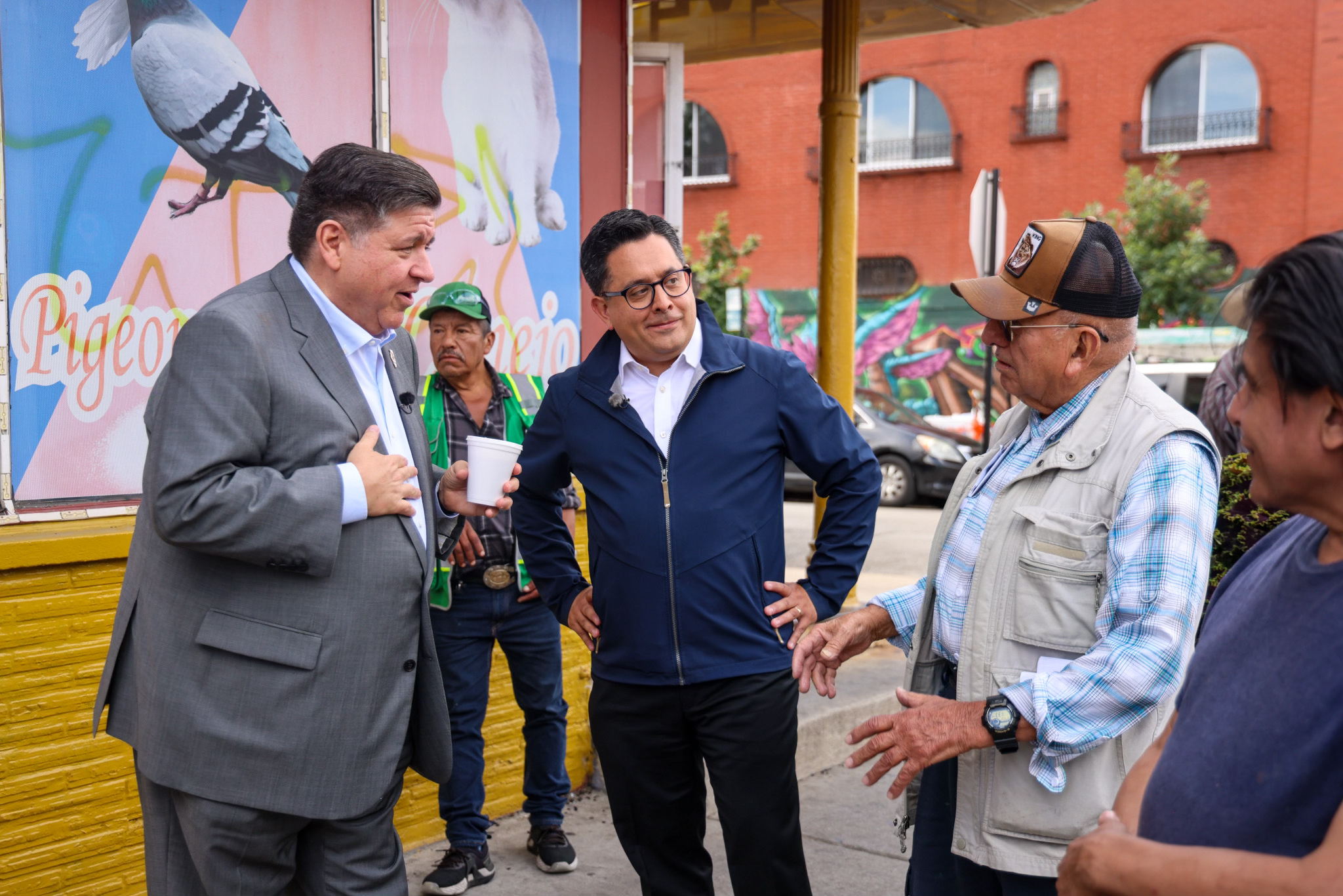 Gov. Pritzker talks with residents of the Little Village neighborhood. (Office of the Governor)