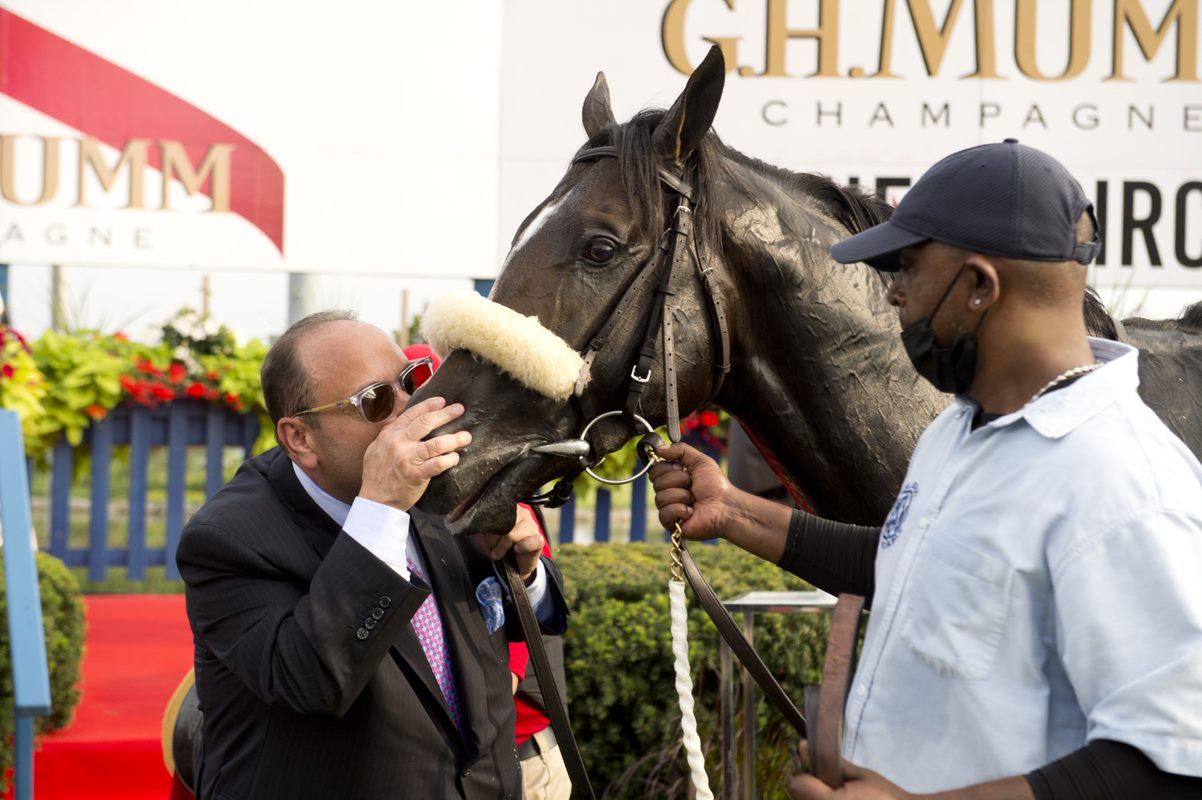 Safe Conduct receives the winner's spoils after capturing the 2021 edition of the Queen's Plate at Woodbine. (Michael Burns Photo)