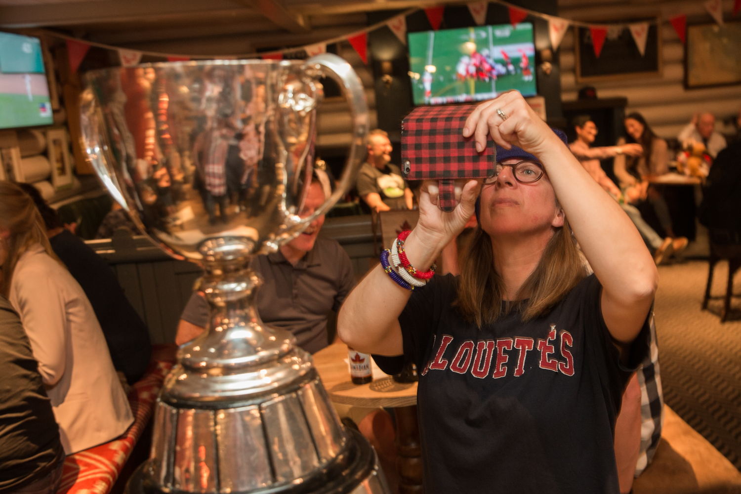 Montreal Alouettes fan take a photo of the Grey Cup. Photo Credit: Jim Ross/CFL