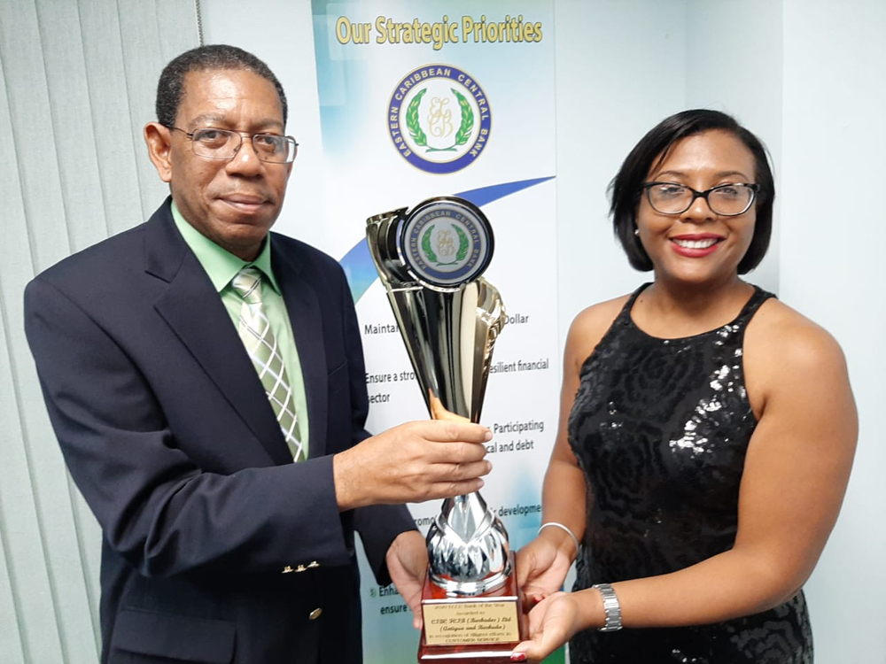 (l-r) ECCB Board Member, Antigua and Barbuda, Whitfield Harris Jr; and Country Head, CIBC/FICB (Barbados) Ltd., Antigua and Barbuda, Ladesa James.