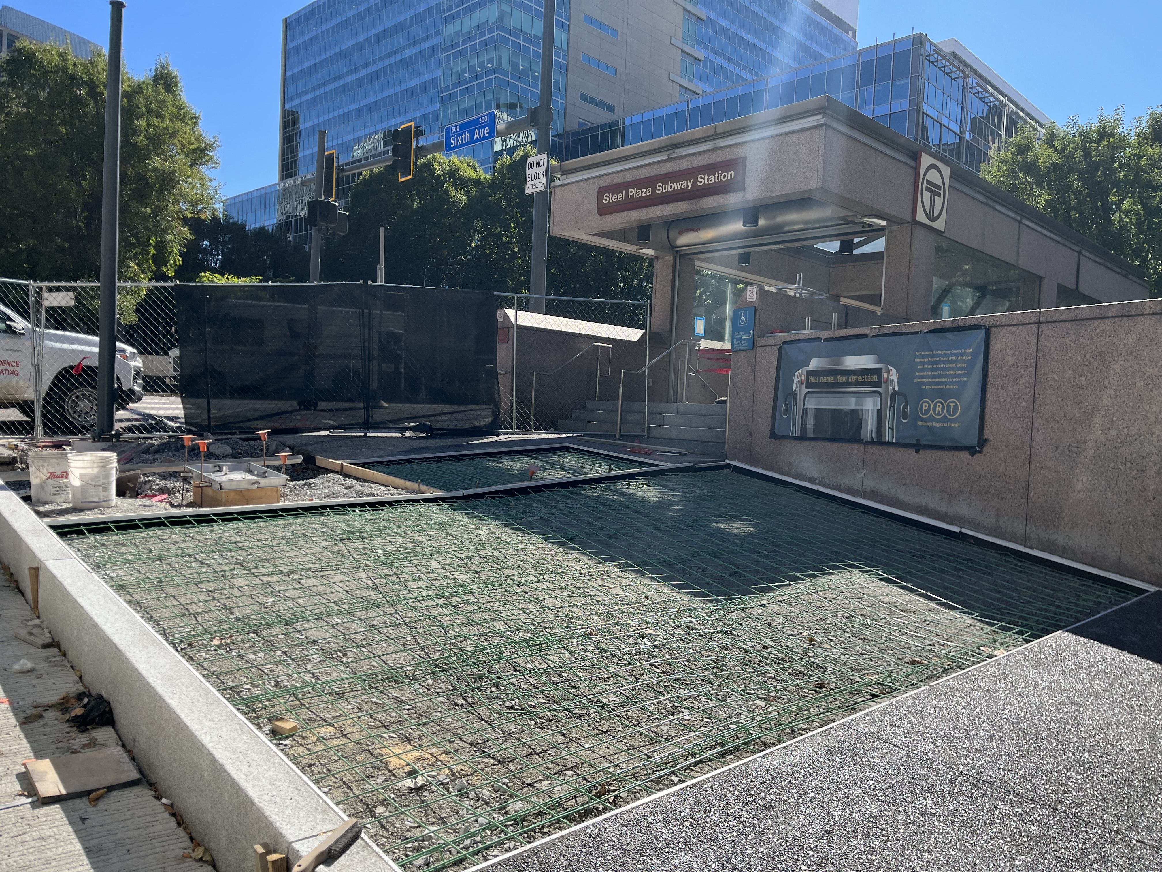 Steel rebar (green) placed outside of Steel Plaza Station in preparation for sidewalk installation