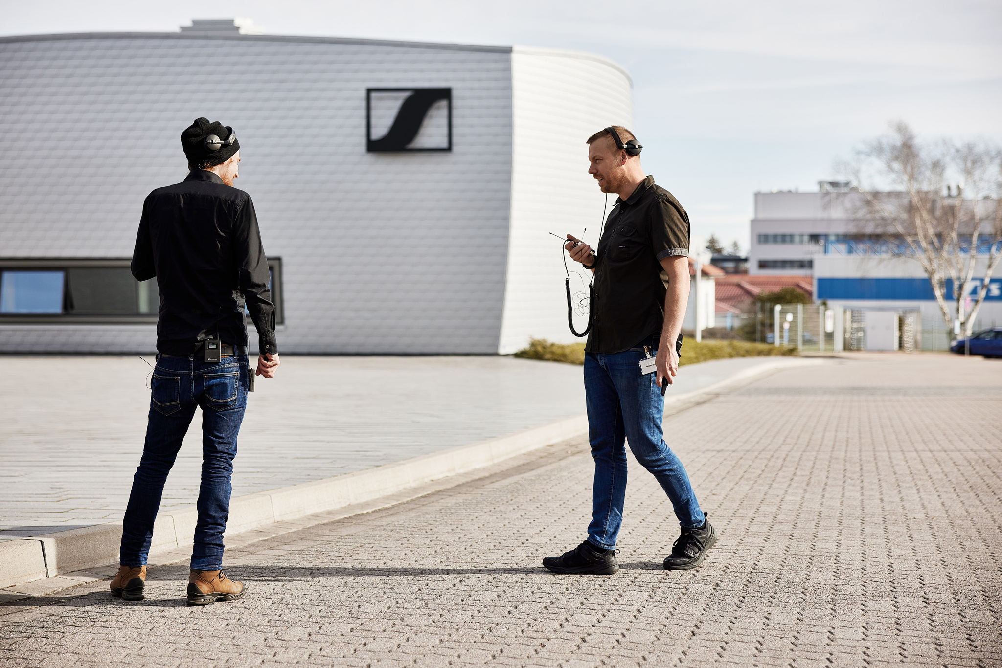 Marco and Jonas speaking into the WMAS connection while wearing and carrying four directly interfering narrowband devices