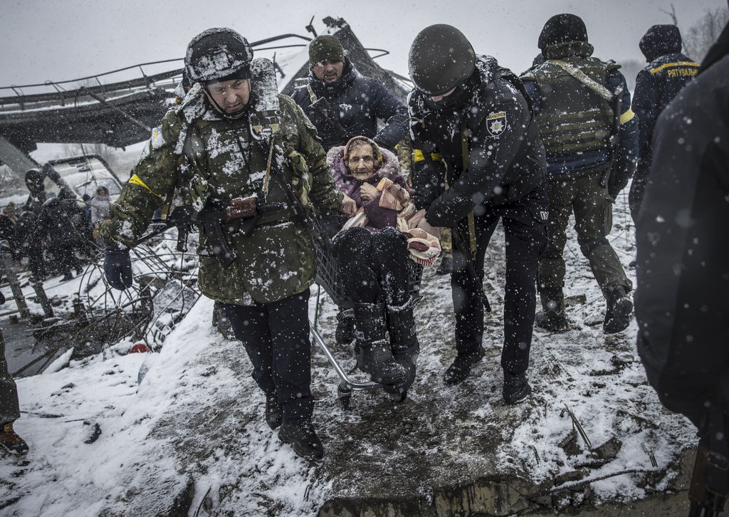 Despite the chilling winds of uncertainty, Ukrainian soldiers extend warmth and compassion to a freezing local resident.