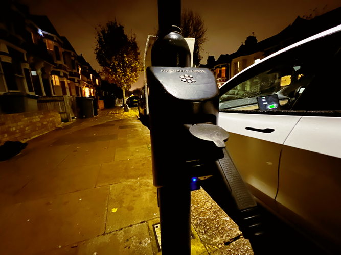 char.gy charging at night on residential street