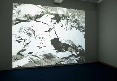 Geert Goiris, Darkcloud, 2012, Looped analogue projection of 38 b/w diapositives (6x7cm)