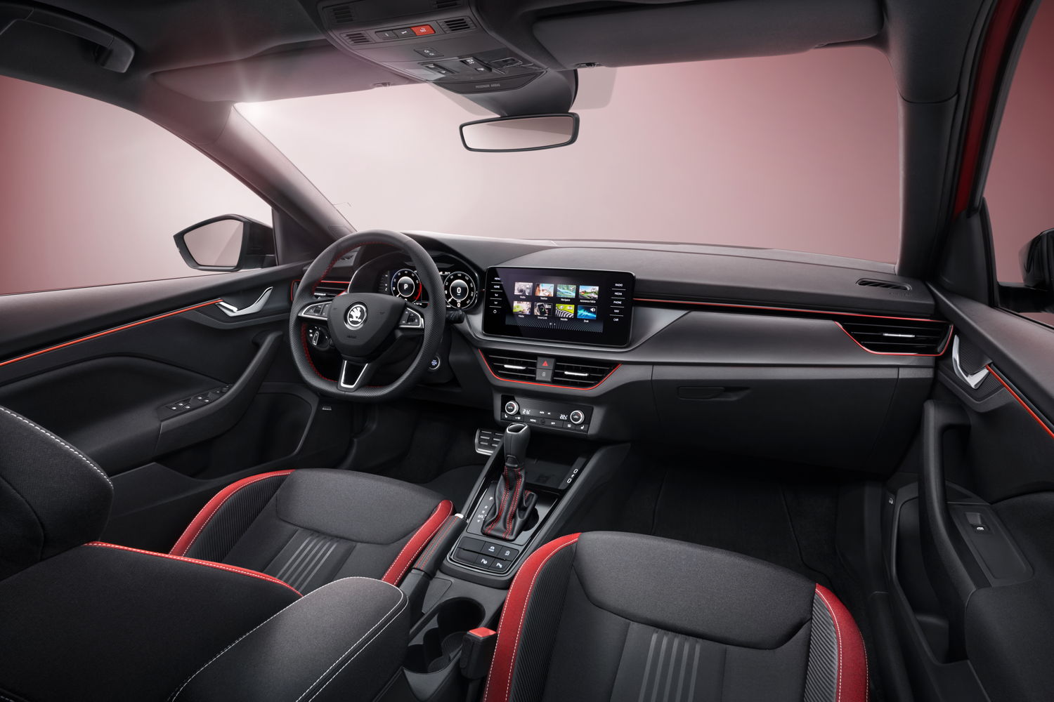 The interior design of the ŠKODA SCALA MONTE CARLO radiates sporting appeal. Height-adjustable sports seats with integrated headrests are complemented by a multifunction sports steering wheel. Red decorative seams and red LED ambient lighting add sporting touches. Other visual details such as pedal trim with an aluminium design round off the sporty ambience in the interior.