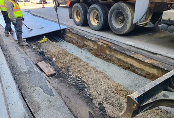 Crews encasing electrical conduit