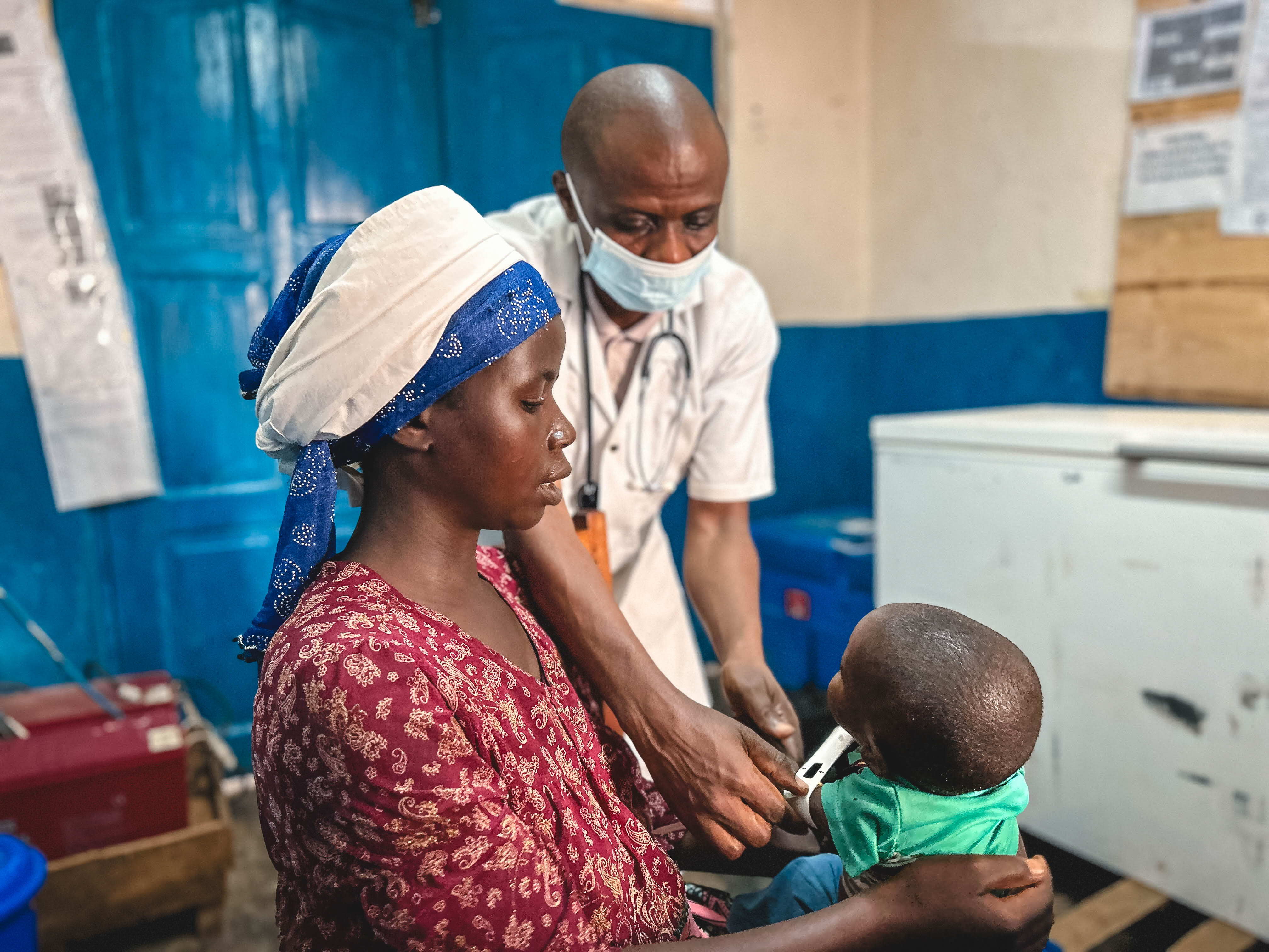 Alliance came with her son François, 12 months old, for a medical consultation as part of the nutrition programme at the Nyabiondo referral health centre, territory of Masisi. François had initially been admitted a month ago in the intensive therapeutic feeding unit. After his health state was getting better, he came back home but comes back every week for a screening to make sure his evolution remains steady, as part of the nutritional program that includes 98 children these last weeks. Photographer: Laora Vigourt. Date: 08/09/2023. Location: Democratic Republic of Congo. Alliance came with her son François, 12 months old, for a medical consultation as part of the nutrition programme at the Nyabiondo referral health centre, territory of Masisi. François had initially been admitted a month ago in the intensive therapeutic feeding unit. After his health state was getting better, he came back home but comes back every week for a screening to make sure his evolution remains steady, as part of the nutritional program that includes 98 children these last weeks. Photographer: Laora Vigourt. Date: 08/09/2023. Location: Democratic Republic of Congo.