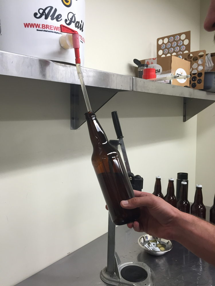 William Brant of CO-Brew fills sanitized bottles with the cantaloupe gose