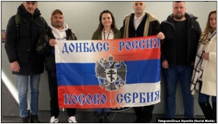 A picture allegedly taken in the new Wagner HQ in St. Petersburg shows Damjan Knezevic and Aleksandar Lisov holding a flag that reads @ “Donbas - Russia, Kosovo - Serbia.”