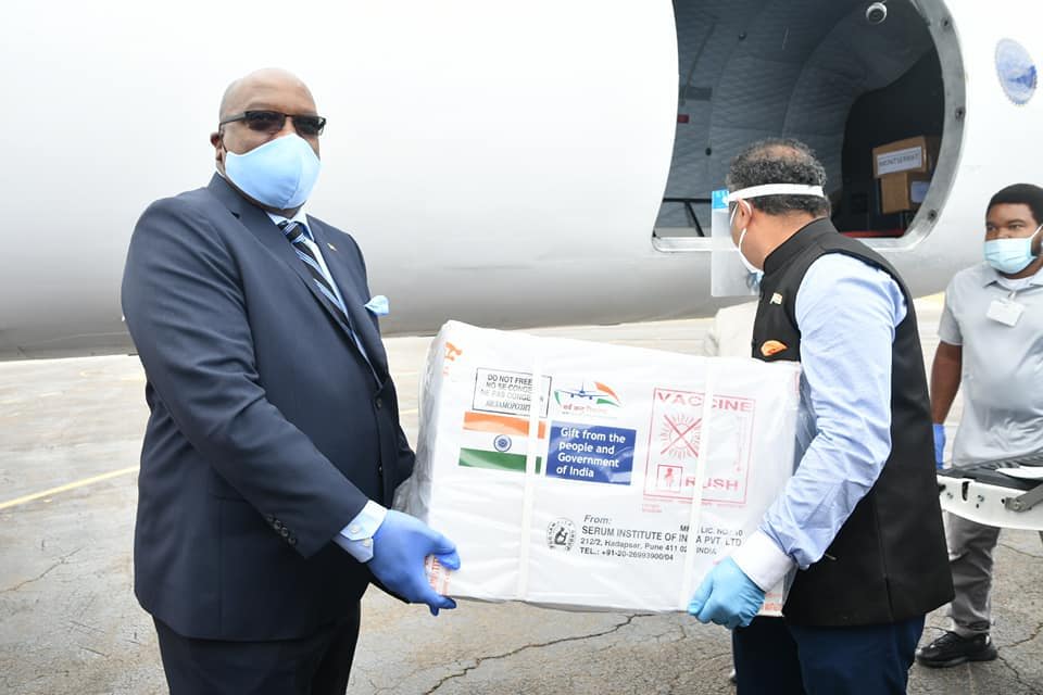 Prime Minister Dr. Hon. Timothy Harris receiving the shipment of vaccines in St. Kitts and Nevis.