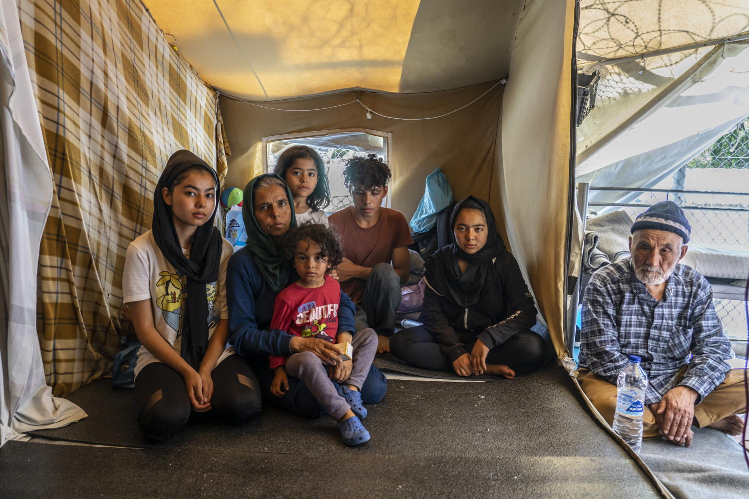 Zeynab is 12-years-old and she was referred by an MSF doctor to the hospital for examinations as six months ago in Turkey she was diagnosed with a brain tumour. She and six family members of hers, including her 97-year-old grandfather, have to share a tent with four other families. The tent is divided into four parts of four to five square metres each. “When we try to sleep we don’t even have space to stretch our legs," they say. Zeyneb often has epileptic crises. A few days ago she had an episode in the middle of the night but no one was here to help us,” her bother explains, clearly frustrated. Taken 14 August 2019, credit Anna Pantelia/MSF