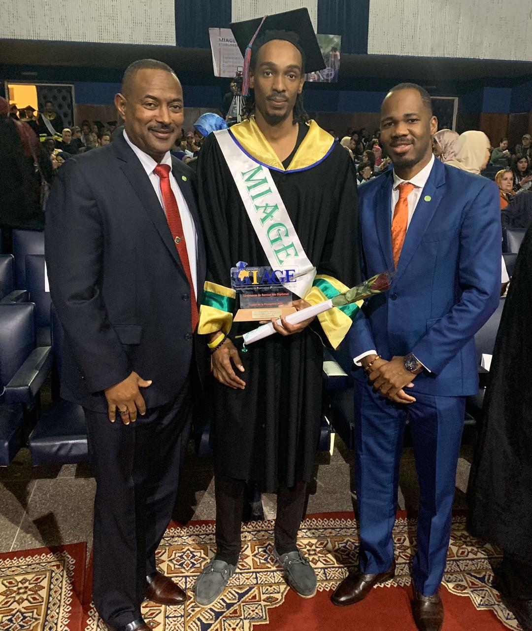 [L-R] His Excellency Ian M. Queeley, Ambassador-Designate to the Embassies of Eastern Caribbean States to the Kingdom of Morocco; Graduate Mr. Terry Gregory Lovell of the Commonwealth of Dominica; and Mr. Kurt Williams, First Secretary to the Embassies of Eastern Caribbean States to the Kingdom of Morocco, in attendance at Mr. Lovell’s graduation ceremony.