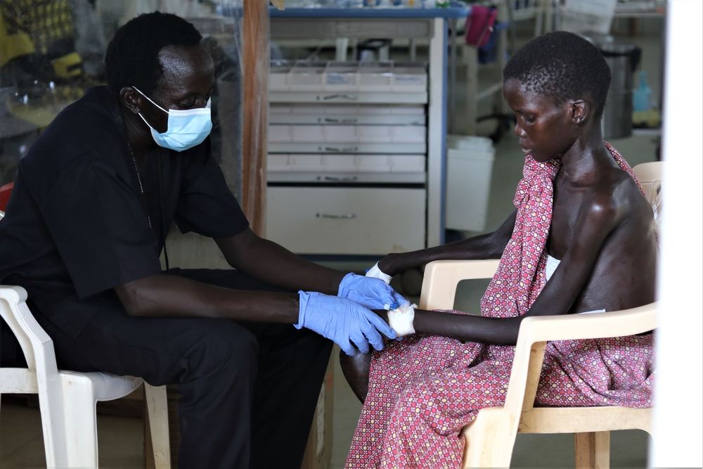 Yoel, thirteen, recovers after surgery at MSF’s hospital in Bentiu Protection of Civilians Site. His father Stephen Manyang Chan, a widower and father of five, saved his life by carrying him to the MSF clinic in Leer, Unity State, walking through chest-high waters for two hours. After being examined in MSF’s primarily healthcare centre in Leer, Yoel was flown to Bentiu for an urgent pelvic abscess surgery.

This year’s floods are happening against the backdrop of multiple emergencies including COVID-19, increased violence and fighting, a growing economic crisis, and high levels of food insecurity. The needs for medical care are increasing with a sharp rise in malaria cases and fears of outbreaks of other diseases. Photographer: MSF/Tetiana Gaviuk